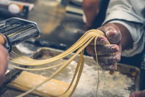 spaghetti coming out of a spaghetti spitter machine wow