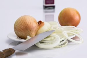 knife cutting onions